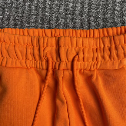 DENIM TEARS COTTON WREATH SWEATPANTS ORANGE